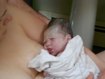 Right after_birth_on_stool_with_baby_out_and_in_arms_7